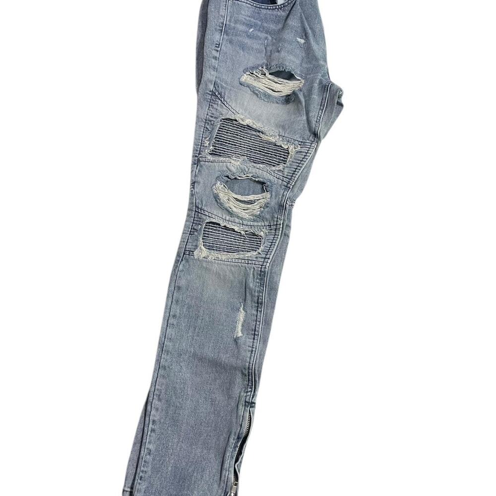 Distressed blue ripped jeans
